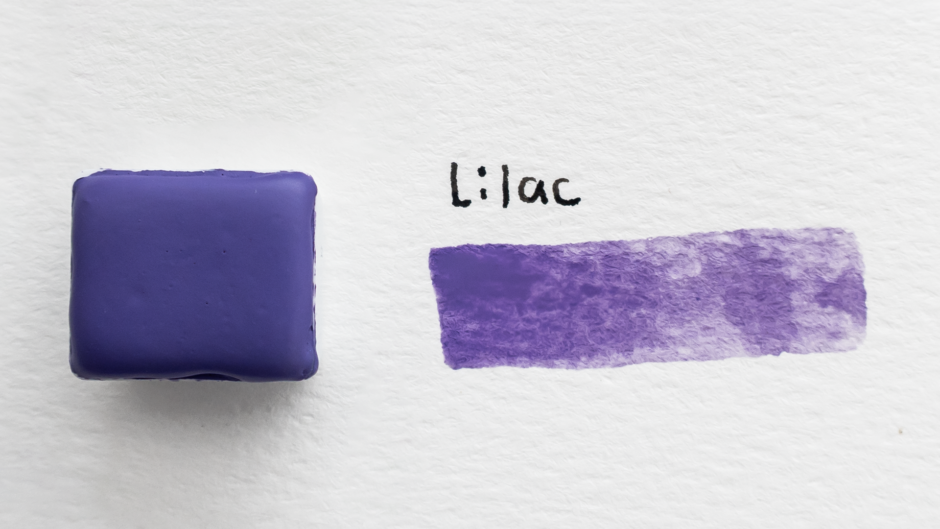Purple watercolor paint swatch with the word 'Lilac' on a white background